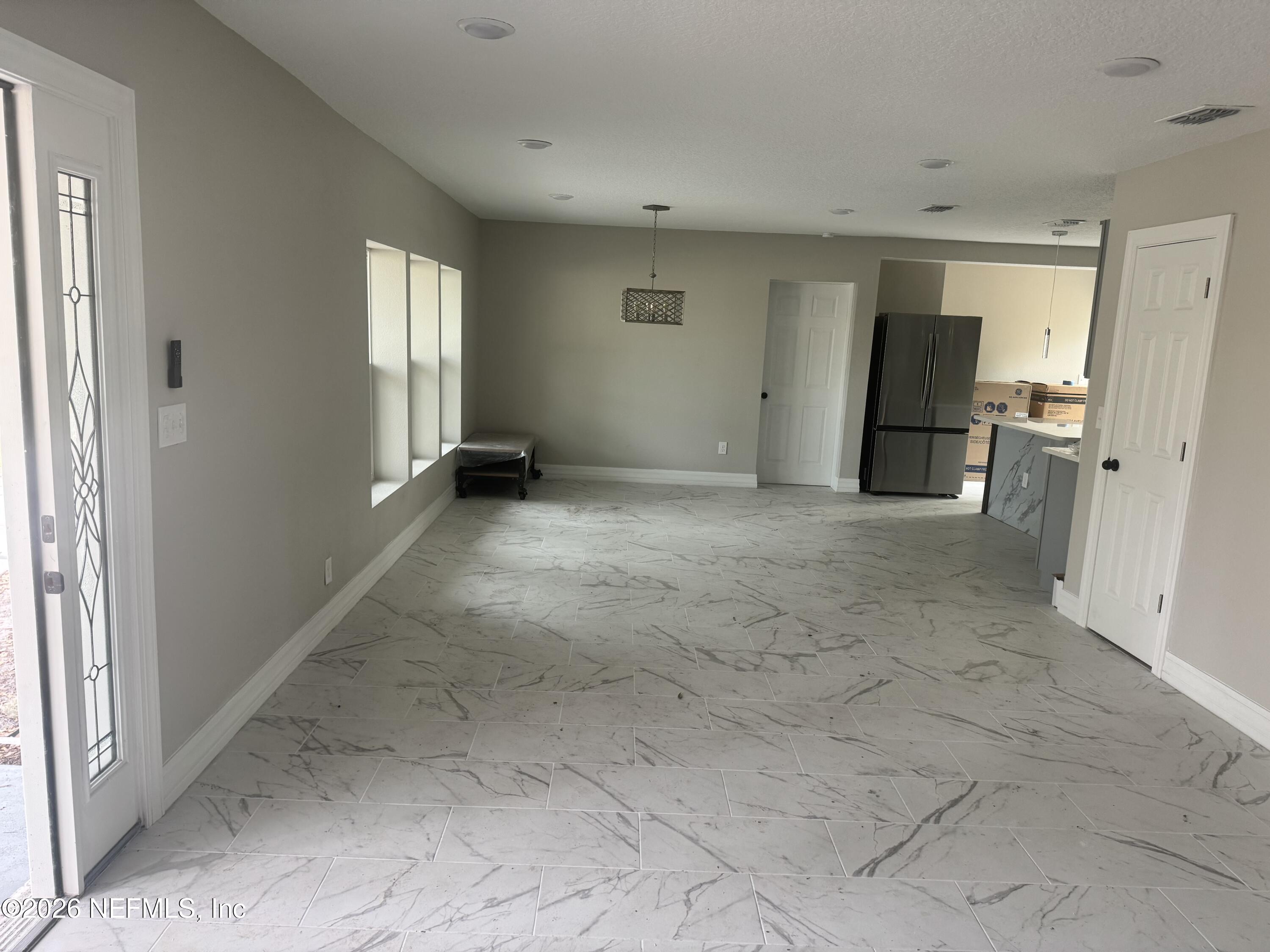 1718 Cornell Road Jacksonville, FL 32207 - Photo 20 of 41 a view of empty room with a fireplace