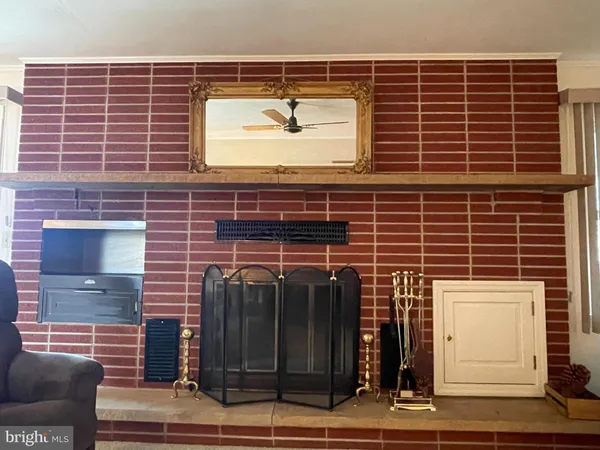 a bed room with a bed window and mirror