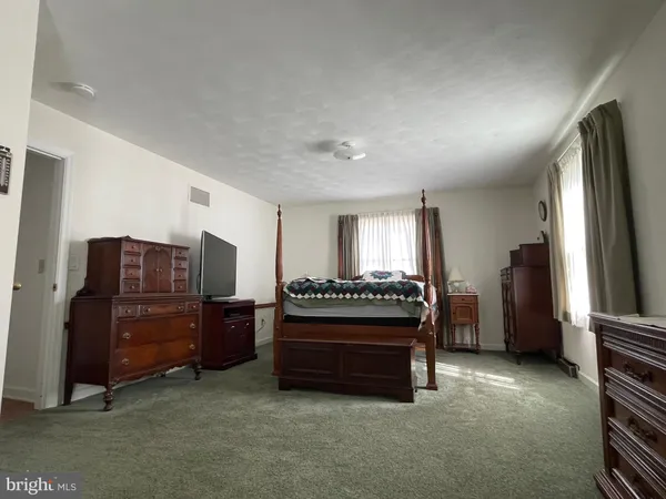 a bathroom with a tub and sink