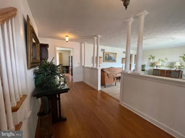 a view of gallery with wooden floor