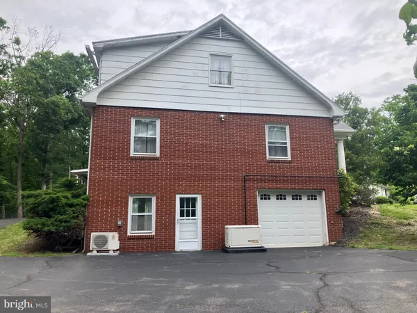 a view of a livingroom with furniture window and wooden floor