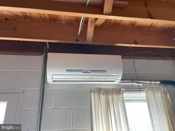 a view of a chairs in backyard of house