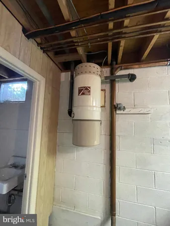 a white house that has a tree on the side of it