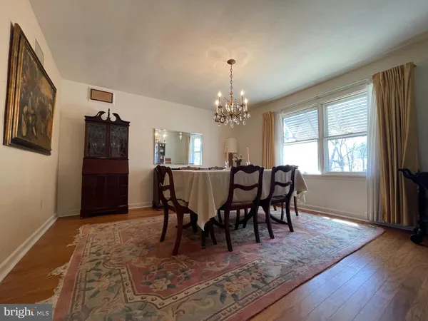 a view of a dining room with furniture and window