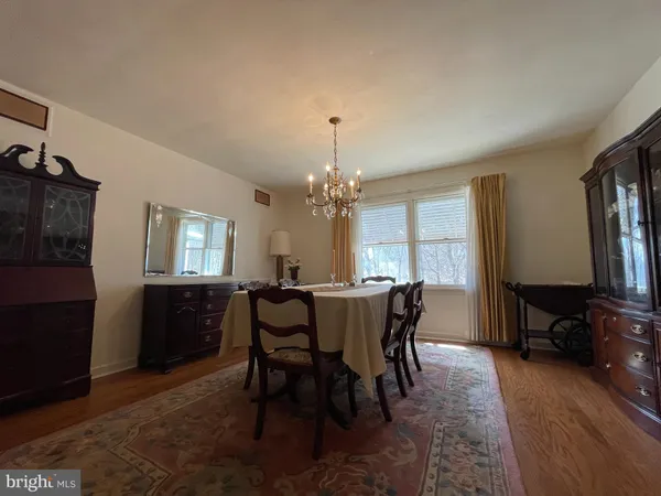 a kitchen with stainless steel appliances granite countertop a sink counter space cabinets and a large window
