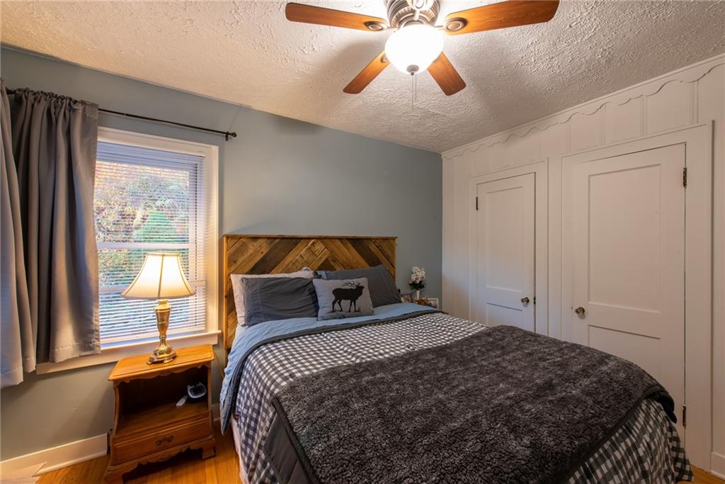 250 Rhoda Avenue Leechburg, PA 15656 - Photo 13 of 38 a bedroom with a bed and a chandelier