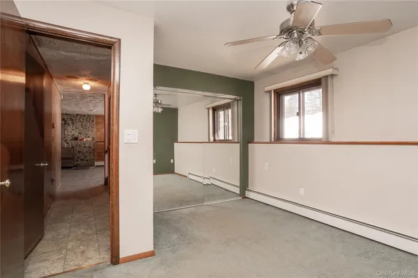wooden floor in an empty room and a window