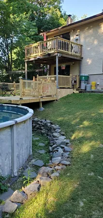 a view of outdoor space with garden and seating area