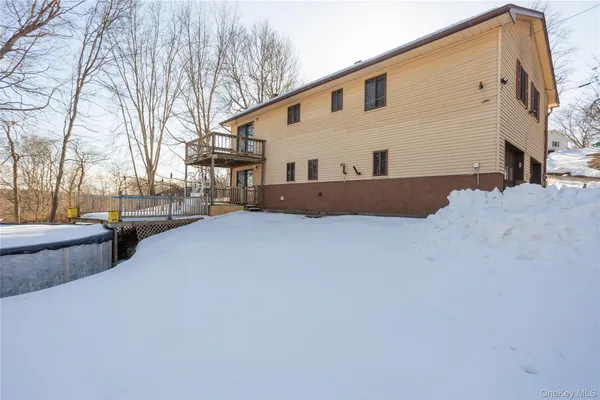 a view of the house with a yard