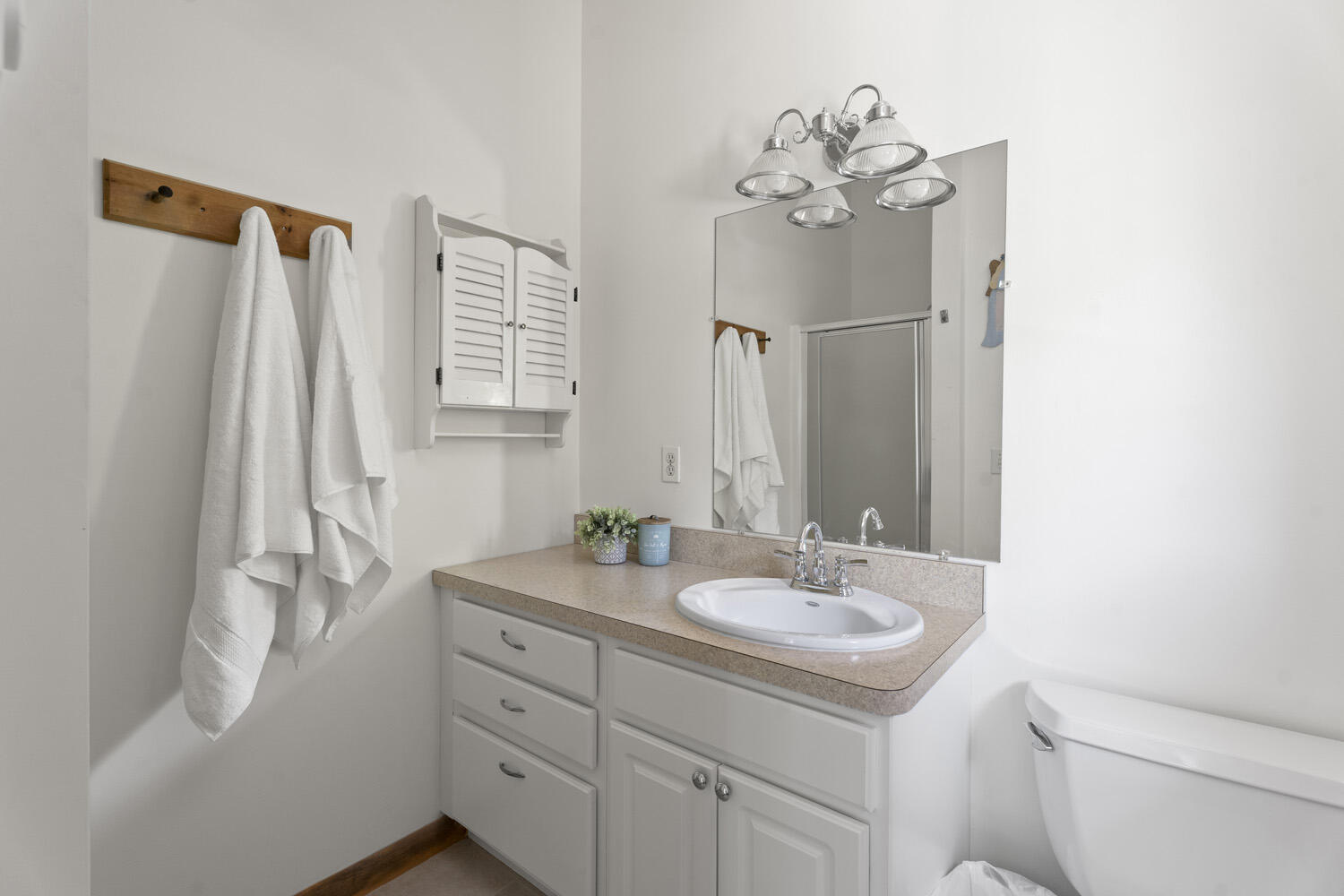 8 Court Street Edgartown, MA 02539 - Photo 13 of 17 a bathroom with a sink a toilet and a mirror