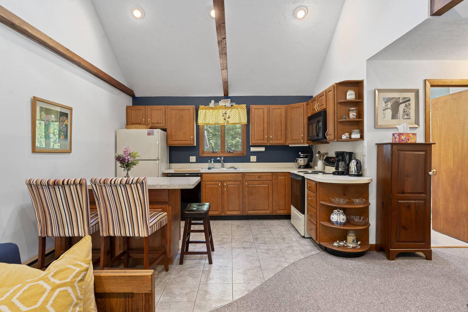 8 Court Street Edgartown, MA 02539 - Photo 7 of 17 a kitchen with stainless steel appliances a stove a sink a refrigerator cabinets and dining table