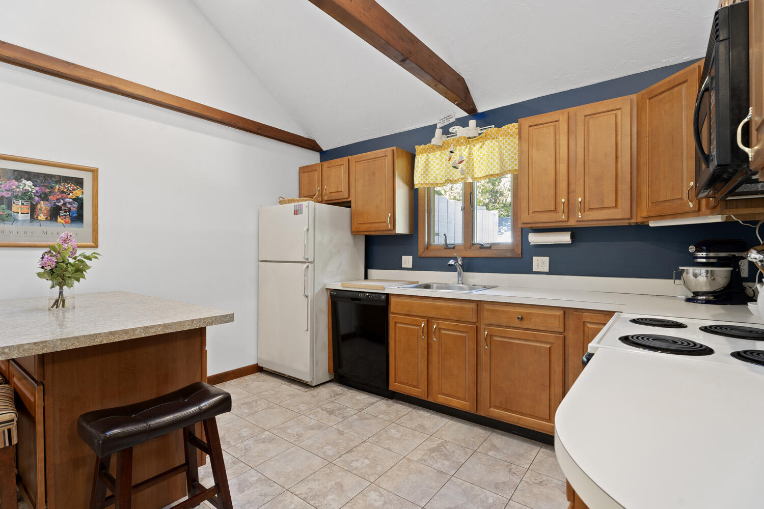 8 Court Street Edgartown, MA 02539 - Photo 8 of 17 a kitchen with stainless steel appliances granite countertop a refrigerator sink and cabinets