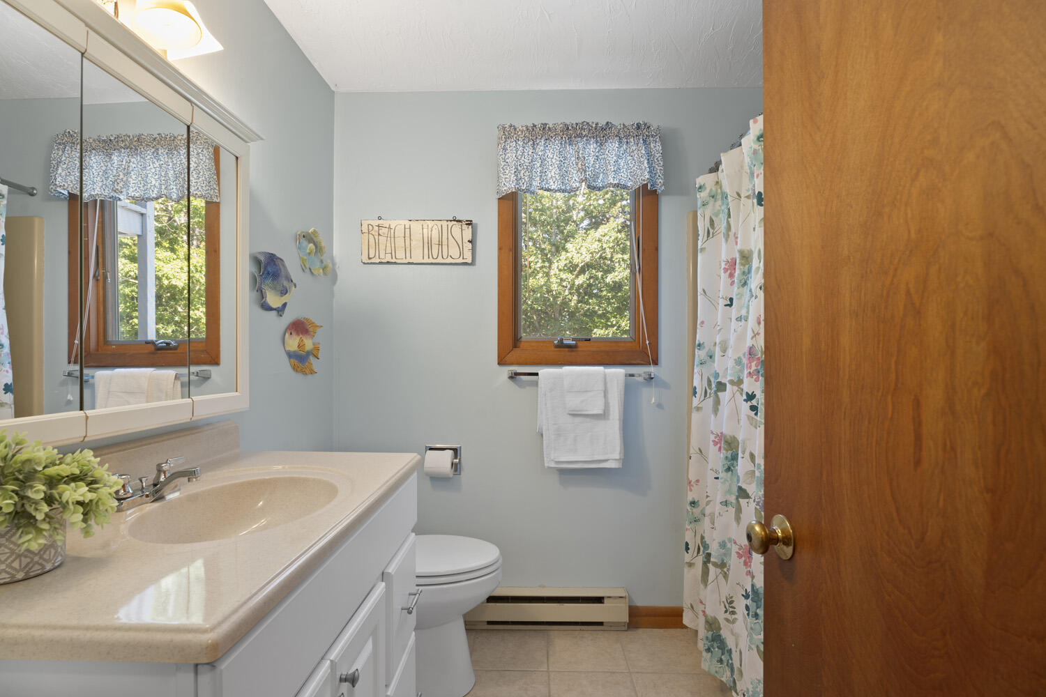 8 Court Street Edgartown, MA 02539 - Photo 9 of 17 a bathroom with a sink toilet and shower