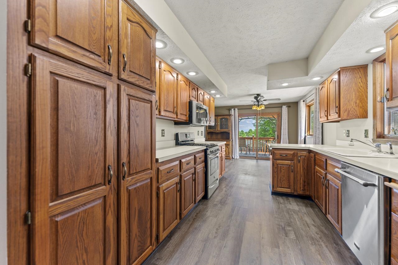1726 Baintree Road Lake Summerset, IL 61019 - Photo 12 of 39 a kitchen with sink cabinets and wooden floor