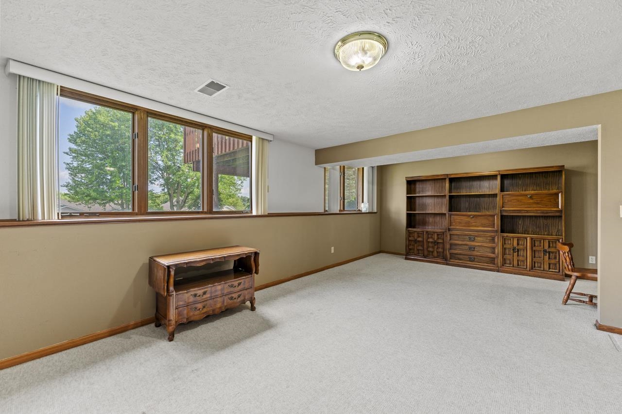 1726 Baintree Road Lake Summerset, IL 61019 - Photo 23 of 39 an empty room with furniture and a window