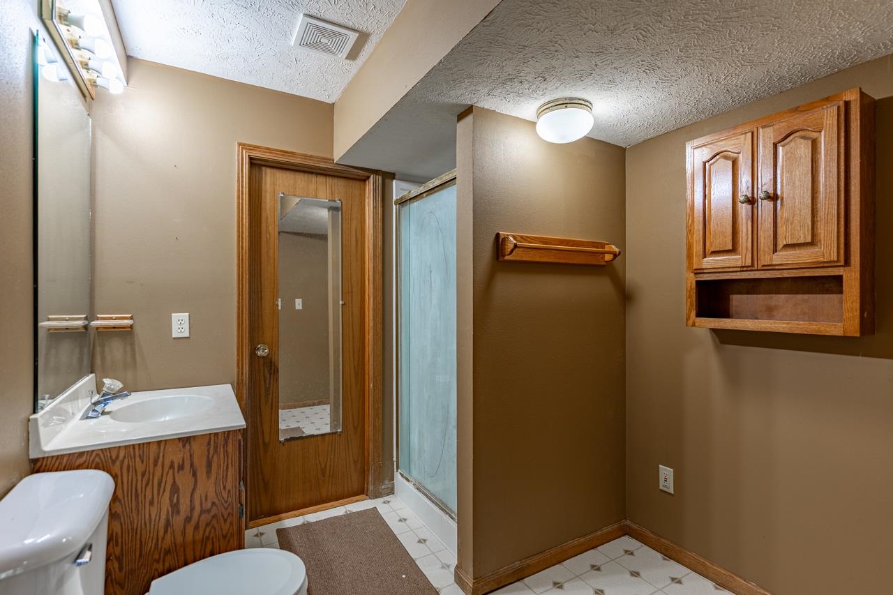 1726 Baintree Road Lake Summerset, IL 61019 - Photo 25 of 39 a bathroom with a granite countertop sink mirror vanity and toilet