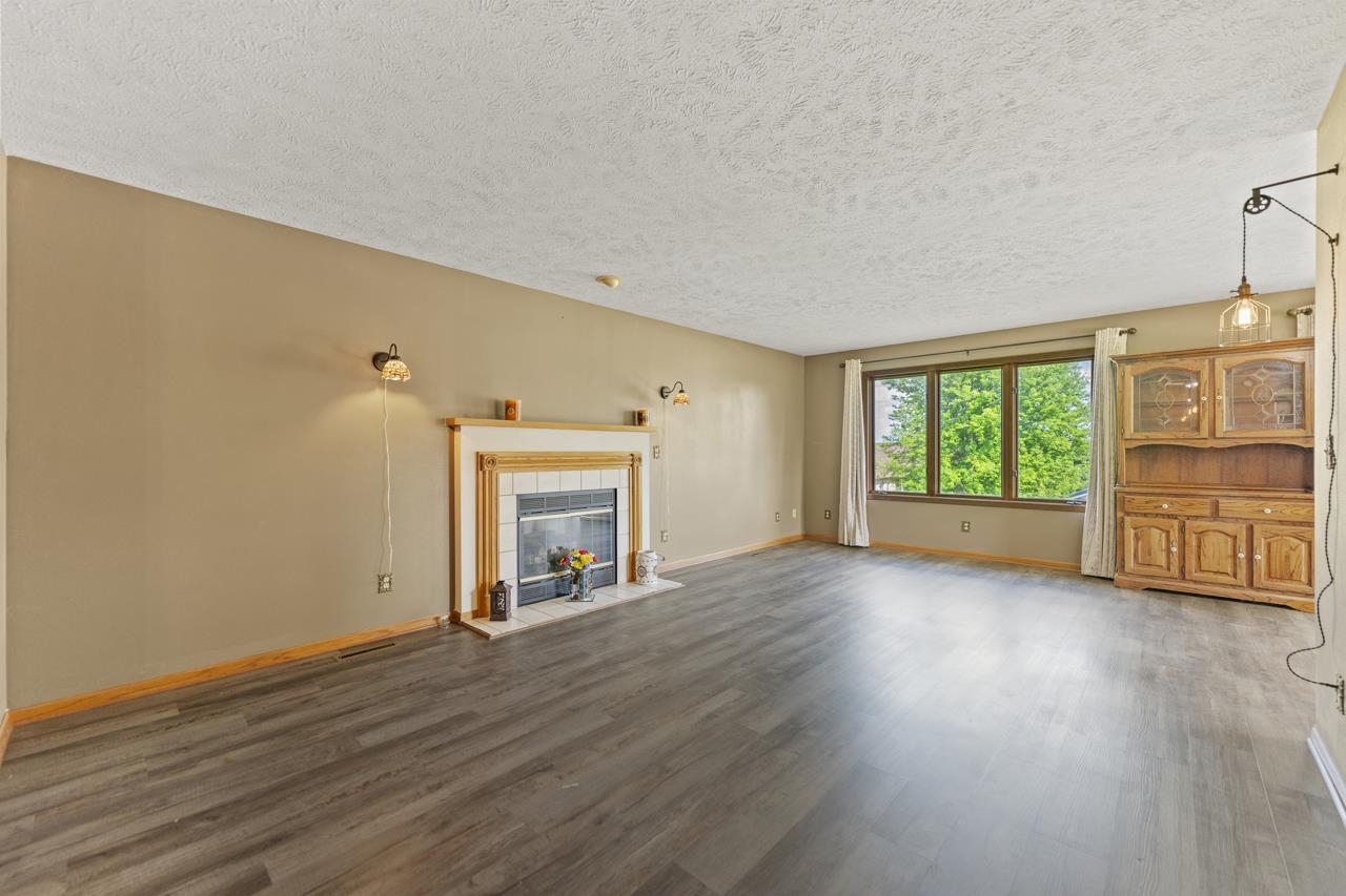 1726 Baintree Road Lake Summerset, IL 61019 - Photo 6 of 39 a view of an empty room with a window and wooden floor