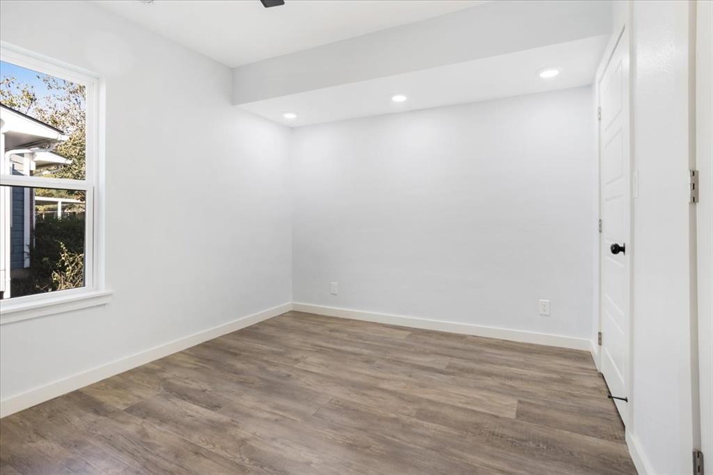 110 East Cunningham Street Bonham, TX 75418 - Photo 10 of 26 wooden floor in an empty room