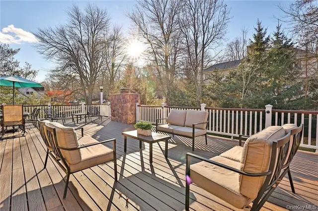 a view of a chairs and table on the deck