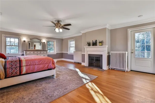 a spacious bedroom with a large bed and a fireplace