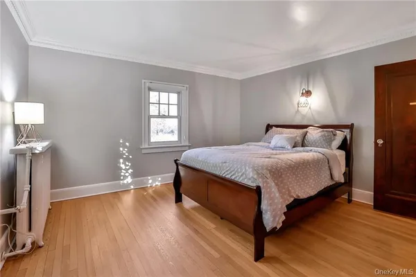 a bedroom with a bed and a night stand