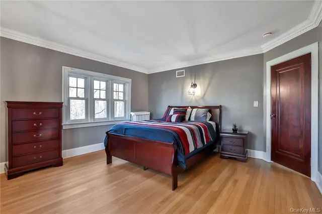 a bed room with a bed and a window