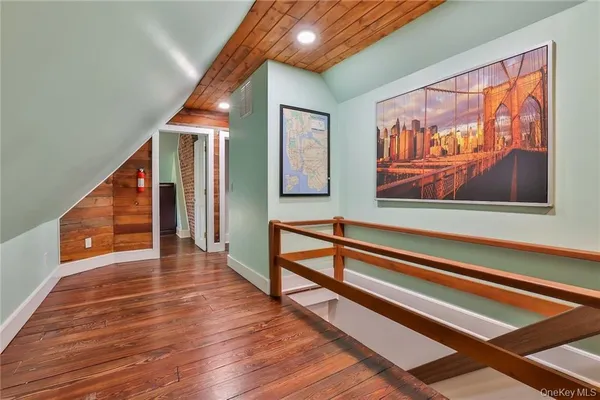 a view of an entryway with wooden floor