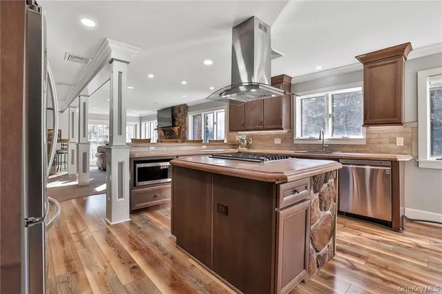 a kitchen with stainless steel appliances granite countertop a stove and a sink