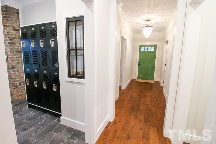 1007 South Person Street Raleigh, NC 27601 - Photo 12 of 25 The front porch opens onto a wide entry foyer that connects with the mudroom which is accessible from the driveway and side porch.