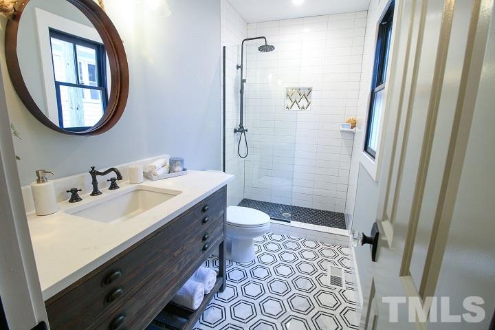 1007 South Person Street Raleigh, NC 27601 - Photo 15 of 25 This bathroom is full of custom touches, from high end designer tile in the shower nook, to octagonal marble tile floors. Your new bathroom won't look like everyone else's!