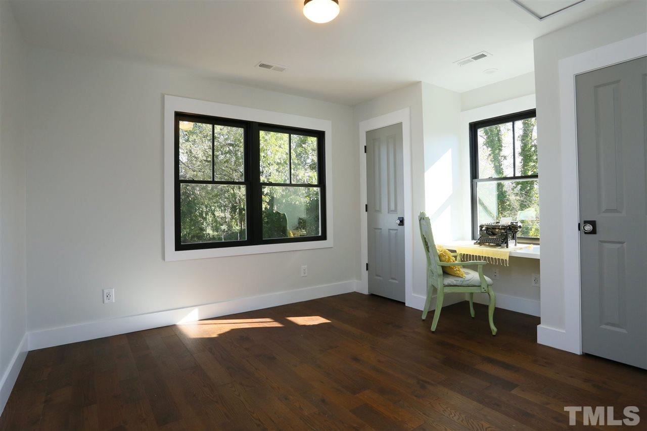 1007 South Person Street Raleigh, NC 27601 - Photo 22 of 25 Upstairs a 4th bedroom and 3rd full bath, as well as a loft area is a private space with an excellent view of the backyard.