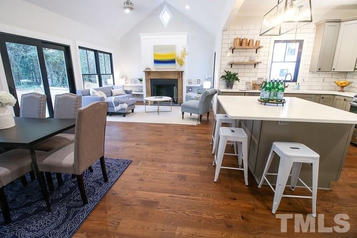 1007 South Person Street Raleigh, NC 27601 - Photo 5 of 25 This is where your best life takes place! Open concept kitchen, living and dining room are perfect for entertaining and conversation. Great flow right onto your deck and HUGE backyard.