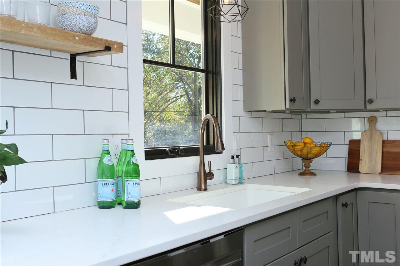 1007 South Person Street Raleigh, NC 27601 - Photo 9 of 25 Quartz , upgraded window and subway tile make for a beautiful brand new kitchen.