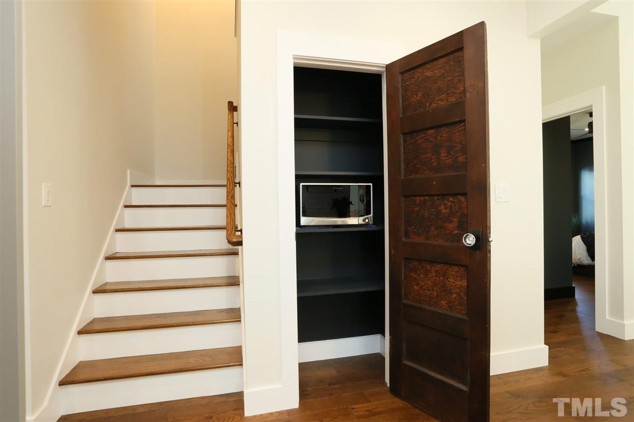1007 South Person Street Raleigh, NC 27601 - Photo 10 of 25 The pantry in the kitchen is complete with a reclaimed door and electrical inside.