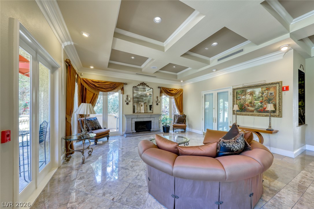 210 East Flamingo Road, Unit 112 Las Vegas, NV 89169 - Photo 36 of 59 Polished tile flooring and an elegant coffered ceiling define this sophisticated formal living space.