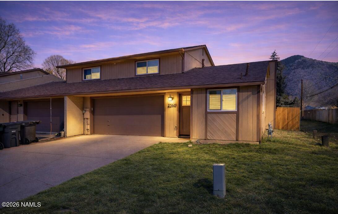 2560 East Cassidy Lane Flagstaff, AZ 86004 - Photo 2 of 31 a front view of a house with a yard