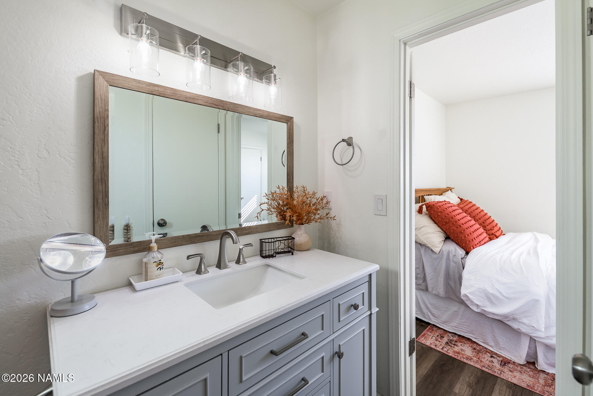 2560 East Cassidy Lane Flagstaff, AZ 86004 - Photo 21 of 31 a bathroom with a sink vanity and a mirror