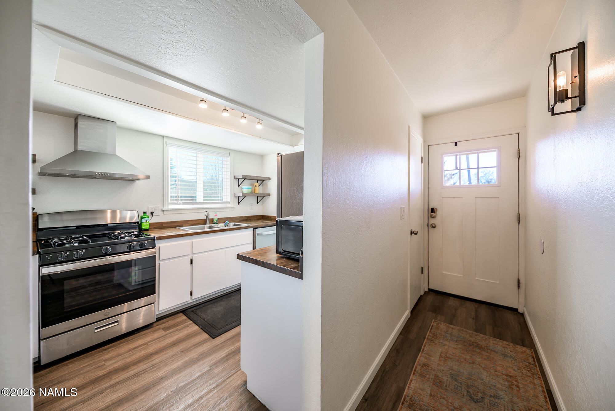 2560 East Cassidy Lane Flagstaff, AZ 86004 - Photo 3 of 31 a kitchen with cabinets and stainless steel appliances