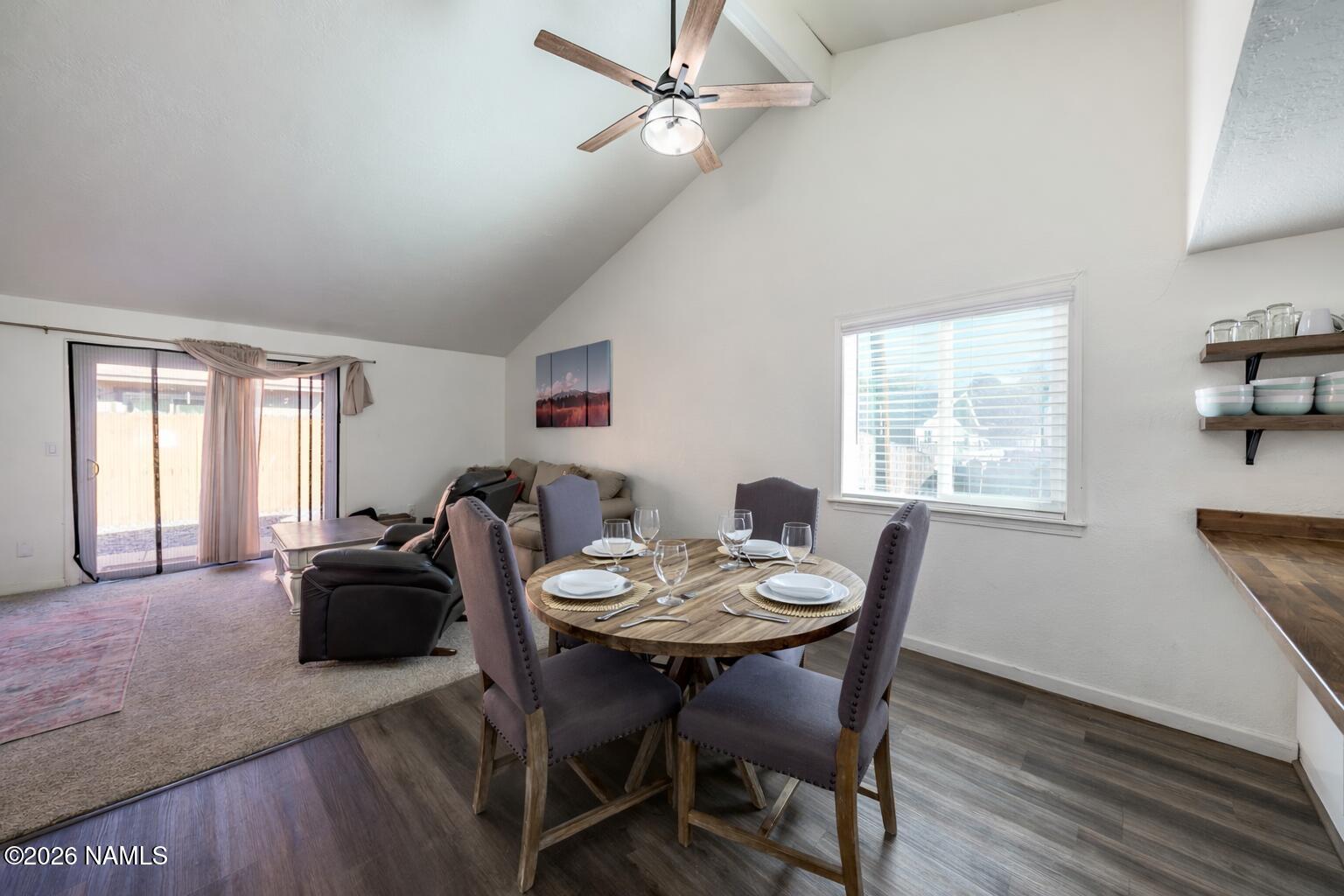 2560 East Cassidy Lane Flagstaff, AZ 86004 - Photo 9 of 31 a view of a dining room with furniture window and wooden floor