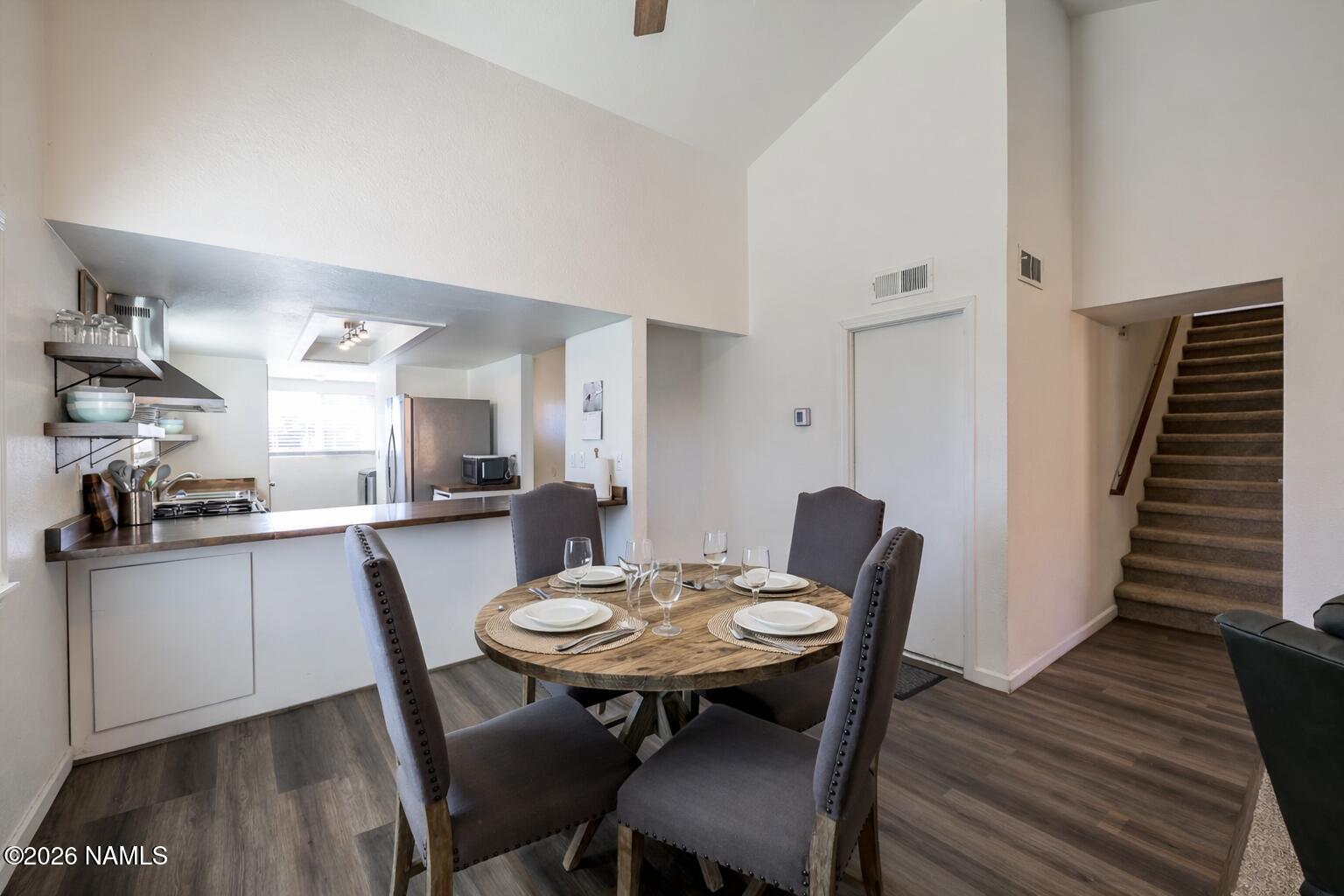 2560 East Cassidy Lane Flagstaff, AZ 86004 - Photo 10 of 31 a kitchen with stainless steel appliances kitchen island a table and chairs in it