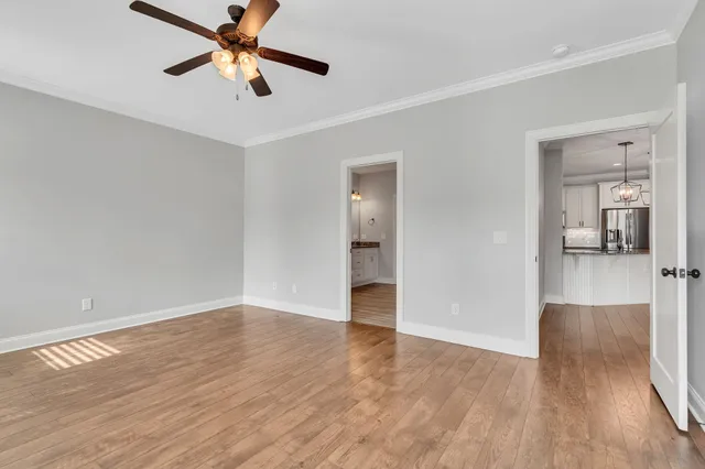 wooden floor in an empty room with a window