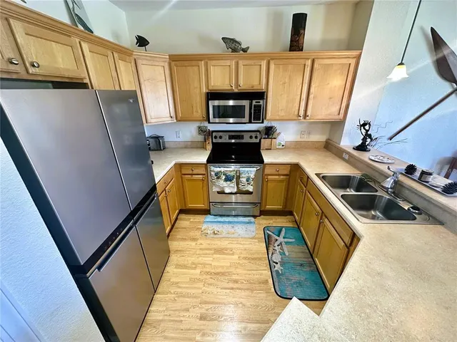 a kitchen with a stove and a sink
