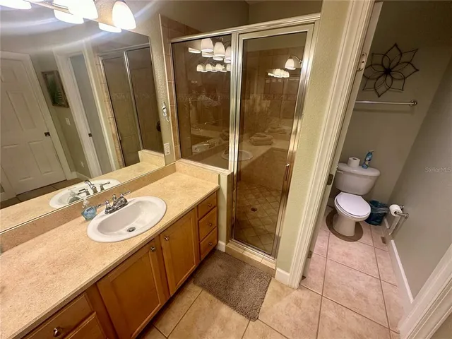 a bedroom with two beds and a window