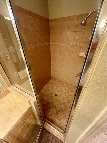 a bedroom with bed and wooden floor