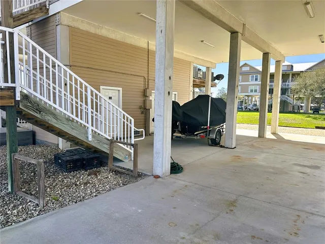 a view of a chairs and table in the patio
