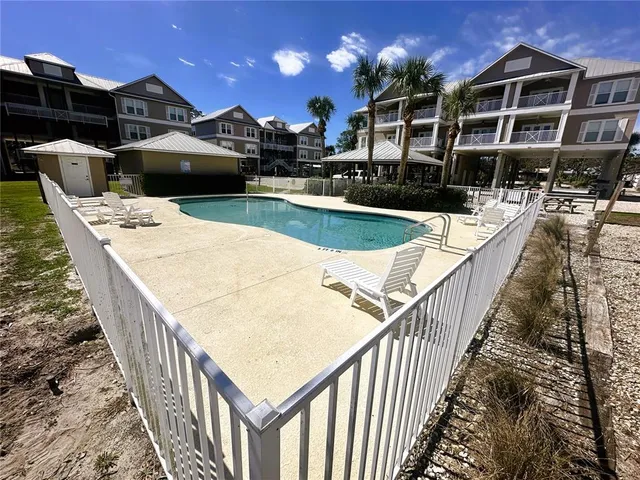 a view of a swimming pool with a patio