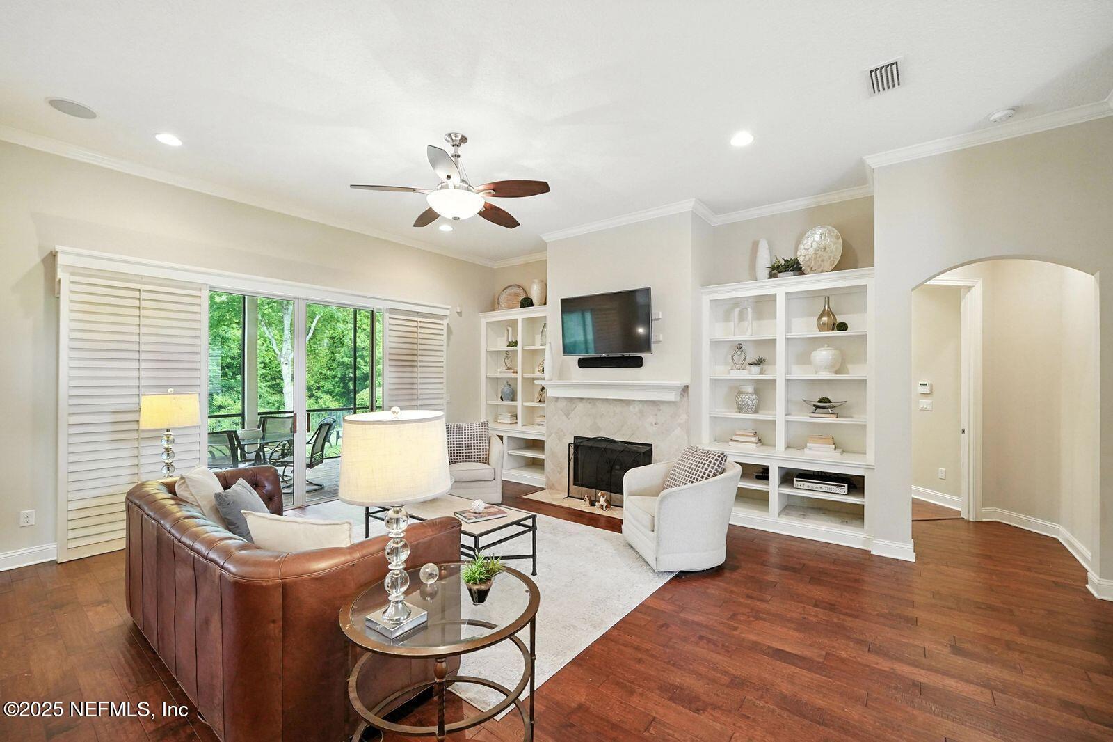 524 Sebastian Square St. Augustine, FL 32095 - Photo 12 of 32 a living room with furniture fireplace and a flat screen tv