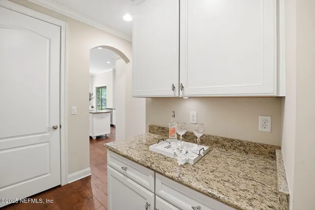 a kitchen with a sink cabinets and washer