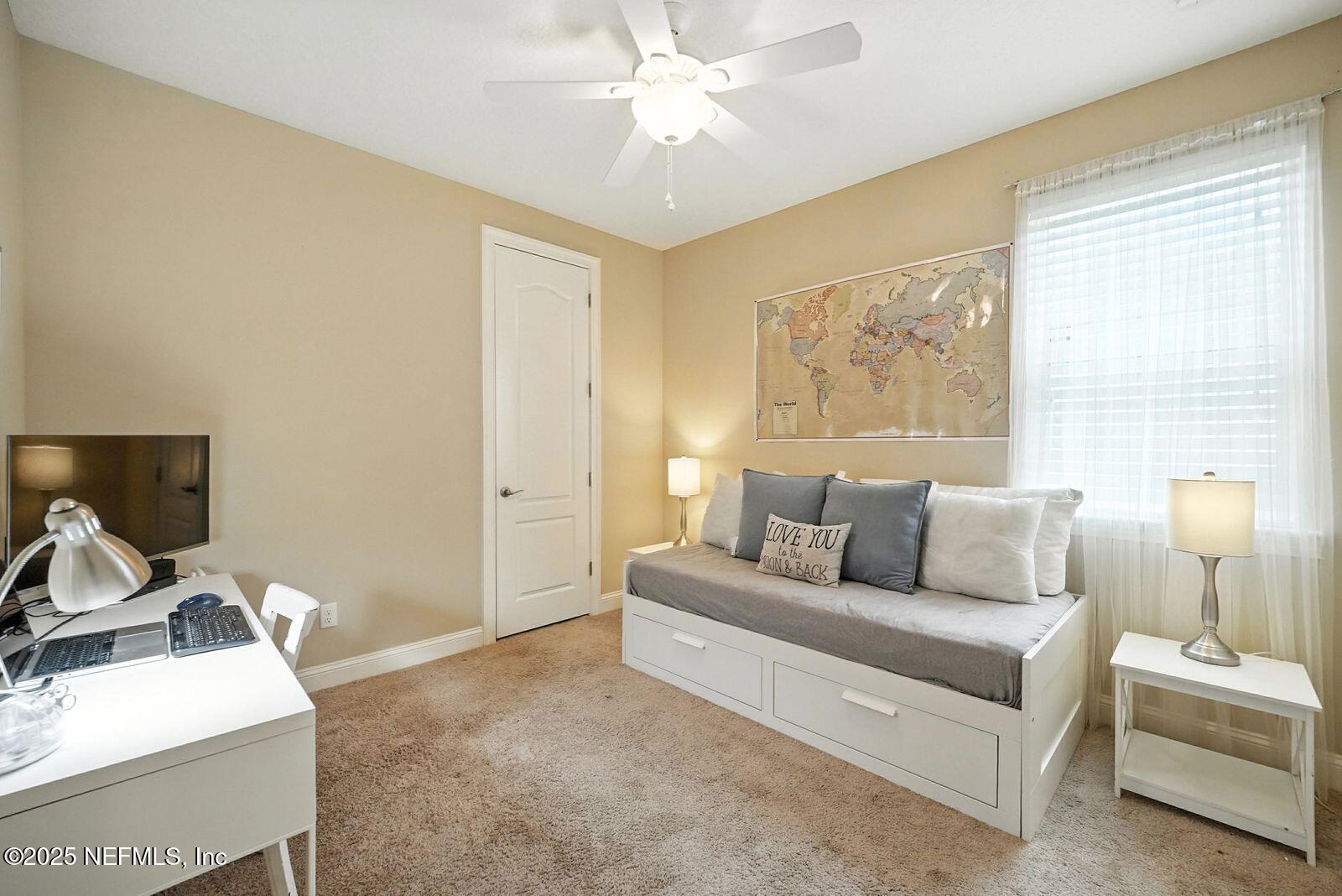 524 Sebastian Square St. Augustine, FL 32095 - Photo 19 of 32 a living room with furniture and a flat screen tv