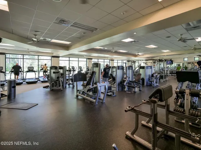 a view of an empty room with basketball court